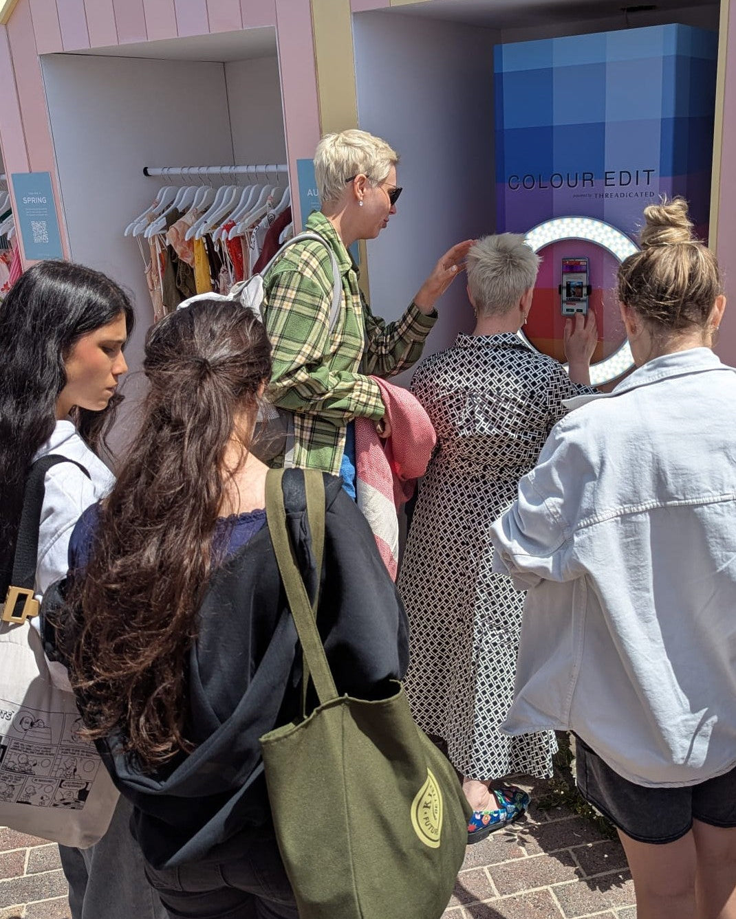 People waiting in line for a fashion pop up activation.